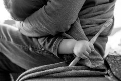Baby hand holding a toothbrush