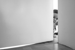 Lumi, peaking through a crack in the door.