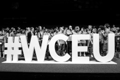 Big wceu hashtag in front, WordCamp Europe 2018 organizers and volunteers behind it.