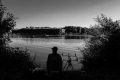 A fisher, sitting and waiting