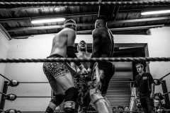 Three wrestlers lock up