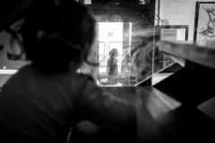 Lumi watching her mom give a session through a window