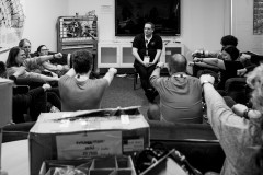 Attendees reach out with one arm during a session about hypnosis