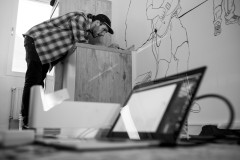 Justin drawing outlines on a blank wall at collective.ruhr coworking space