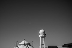 Old water tower next to a circus tent