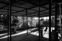 Support pillars casting shadows on the roof in the evening light