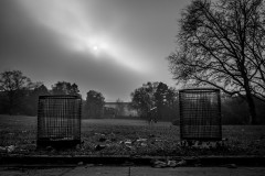 Sun barely visible through thick clouds above Gruga park