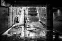 In a subway stating, the escalator is completely covered in snow