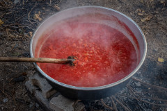 Steaming, hot tomatoe mash in the massive pot
