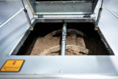 The machine that is converting the olives into mush