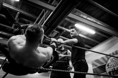 Yuval Goldshmit is hiding in the corner from Hős Antal at wXw Wrestling Academy's LIVE Vol. 3 event