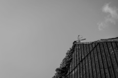 Weathercock ontop of a barn roof