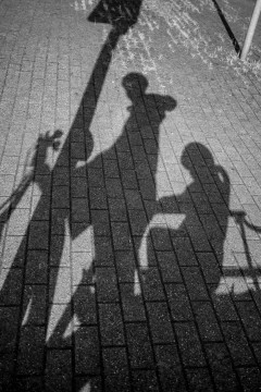Shadow of my daugther and myself on our bike
