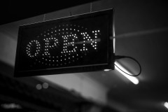 Monochrome image of an open light sign