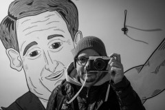 Monochrome mirror selfie, with some wall art behind me