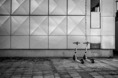 Two scooters sit in front of the A41 highrise