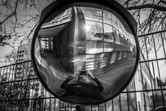 My reflection in a parking lot mirror