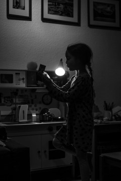 My daugther unwrapping a birthday present at 6 in the morning
