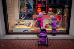 My daugther looking into the display-window of a shoe store