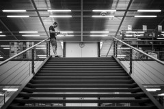 WordCamp Organizer Michael Hörnlimann stands atop the stairs in Centre Loewenberg, waiting for attendees to arraive at WordCamp Switzerland 2023