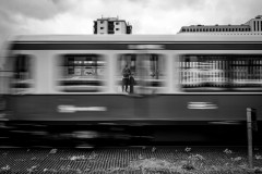 My reflection in the window of a bypassing train