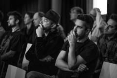 Vasilis Van Gemert and Bastian Allgeier are watching a talk at border:none 2023 in Nuremberg