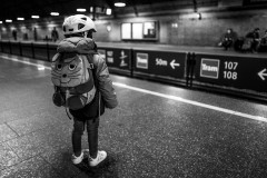 My daugther wearing her mouse backback, waiting for the subway to arrive