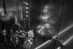 My daugther and her teddy bear in an elevator
